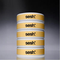 Five cans of Sesh+ Mango nicotine pouches, stacked