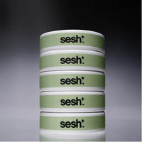 Five cans of Sesh+ Wintergreen nicotine pouches, stacked